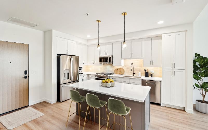 a kitchen with white cabinets