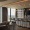 a kitchen with floor-to-ceiling windows