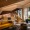 a wide open lobby with ample seating and a staircase