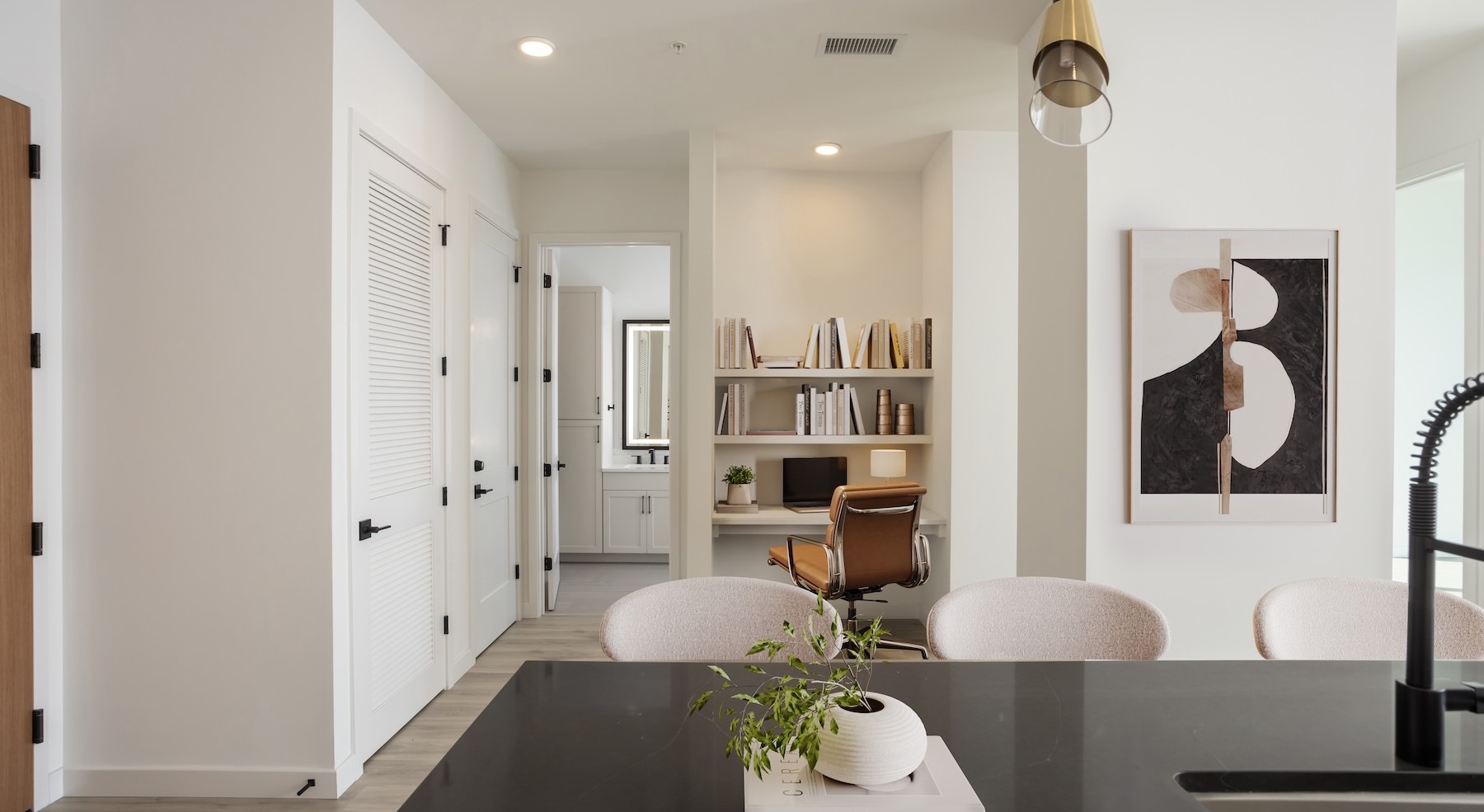 living room with office nook with a bookshelf