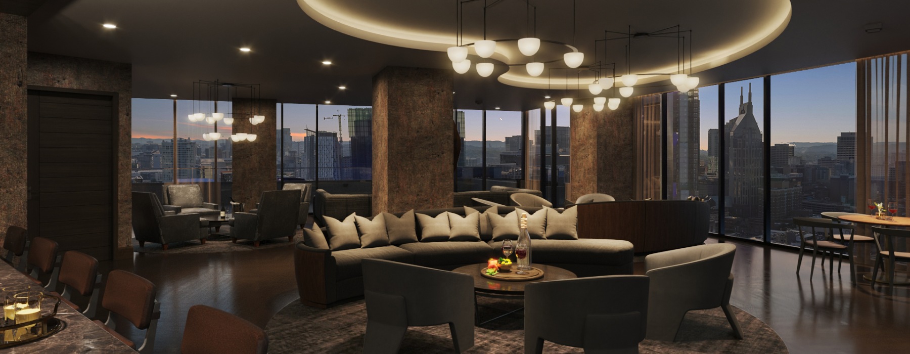 a room with a large window and a large couch and chairs