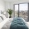 Bedroom with natural lighting and high ceilings